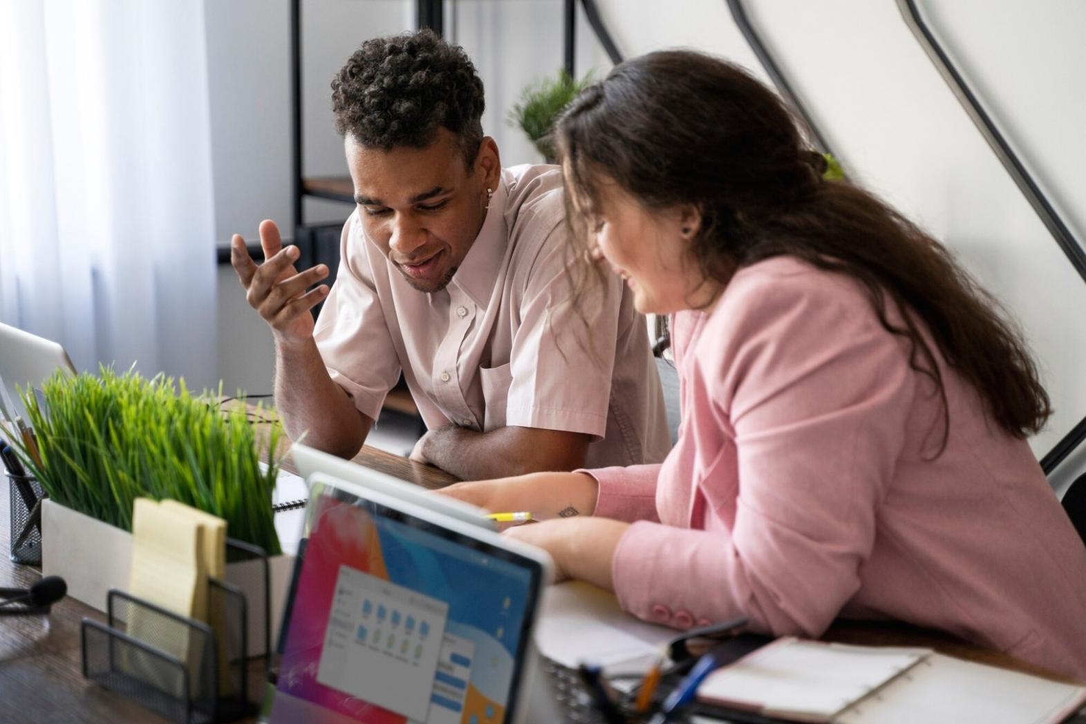 Person reviewing financial documents at desk with natural lighting